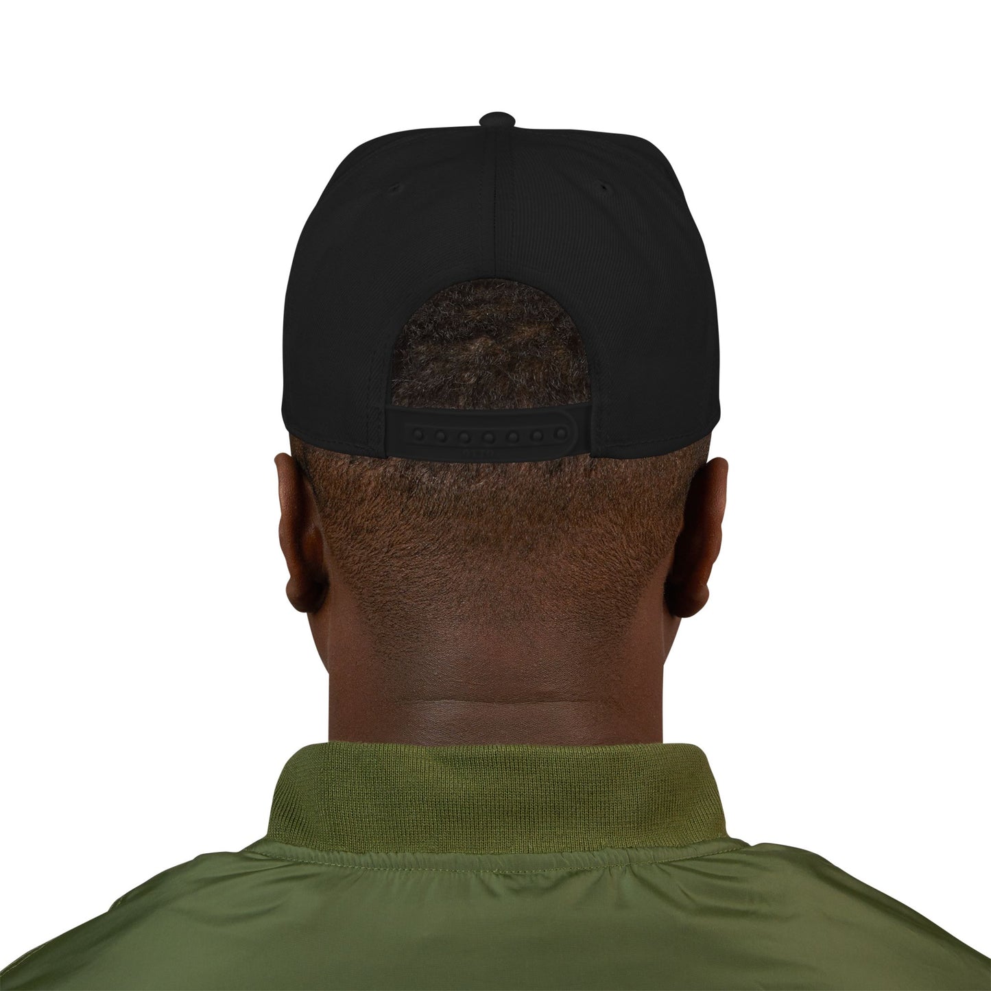 Person wearing a black cap and green shirt on a white background