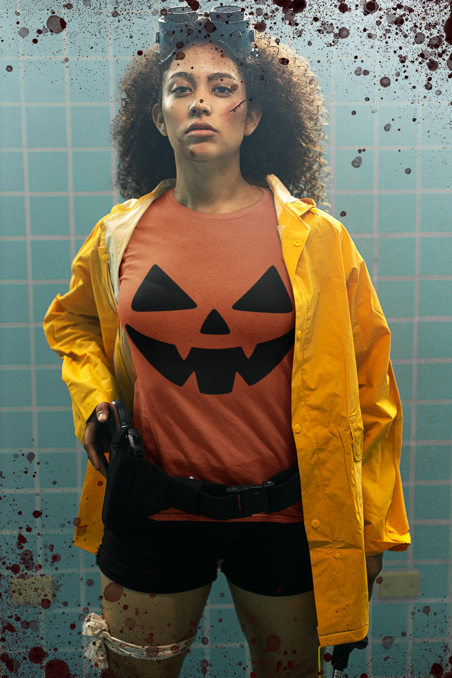 Person wearing a Halloween-themed outfit with a pumpkin shirt and yellow raincoat against a tiled wall background.