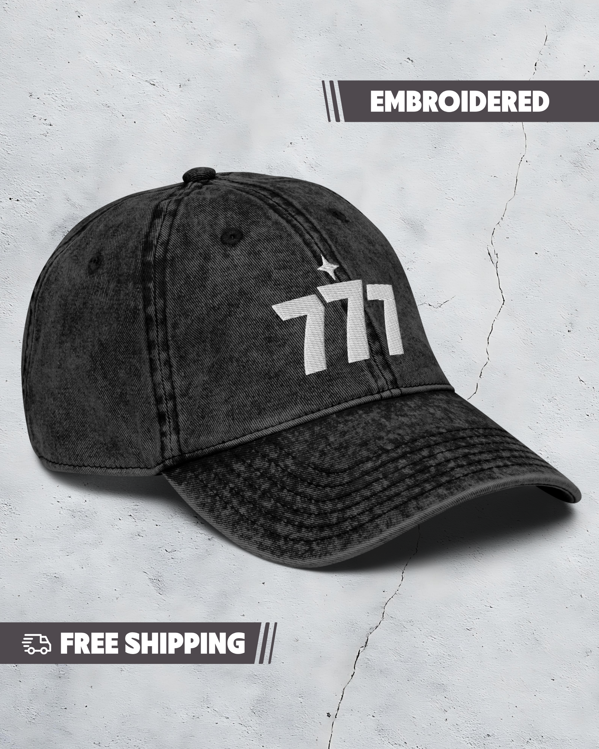 Black denim cap with embroidered number 777 on a textured gray background