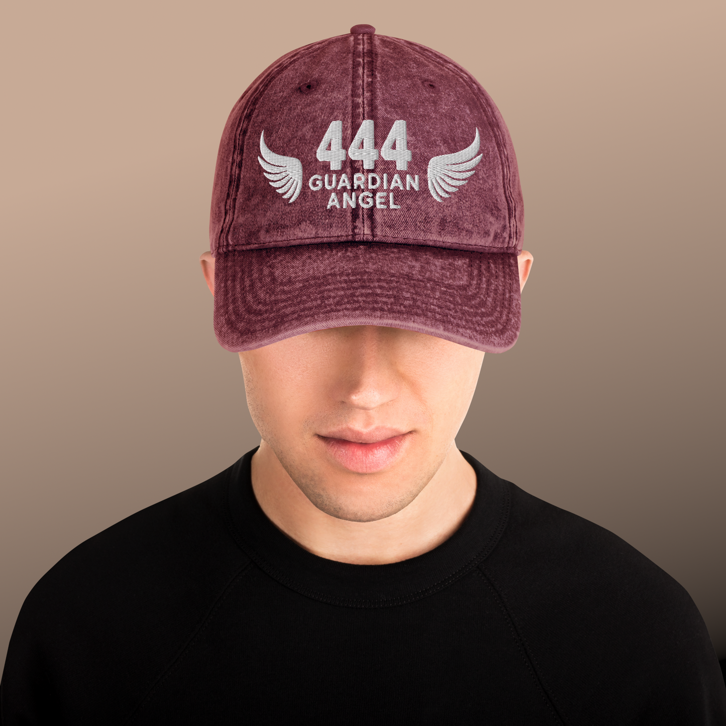 Maroon cap with '444 Guardian Angel' text and wings on a plain background