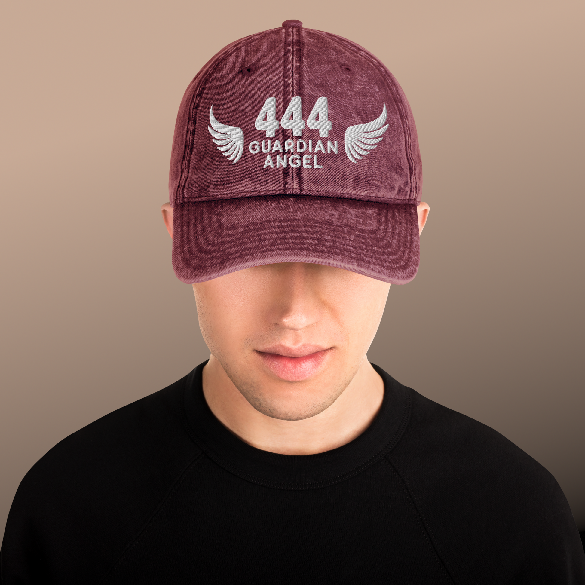 Maroon cap with '444 Guardian Angel' text and wings on a plain background