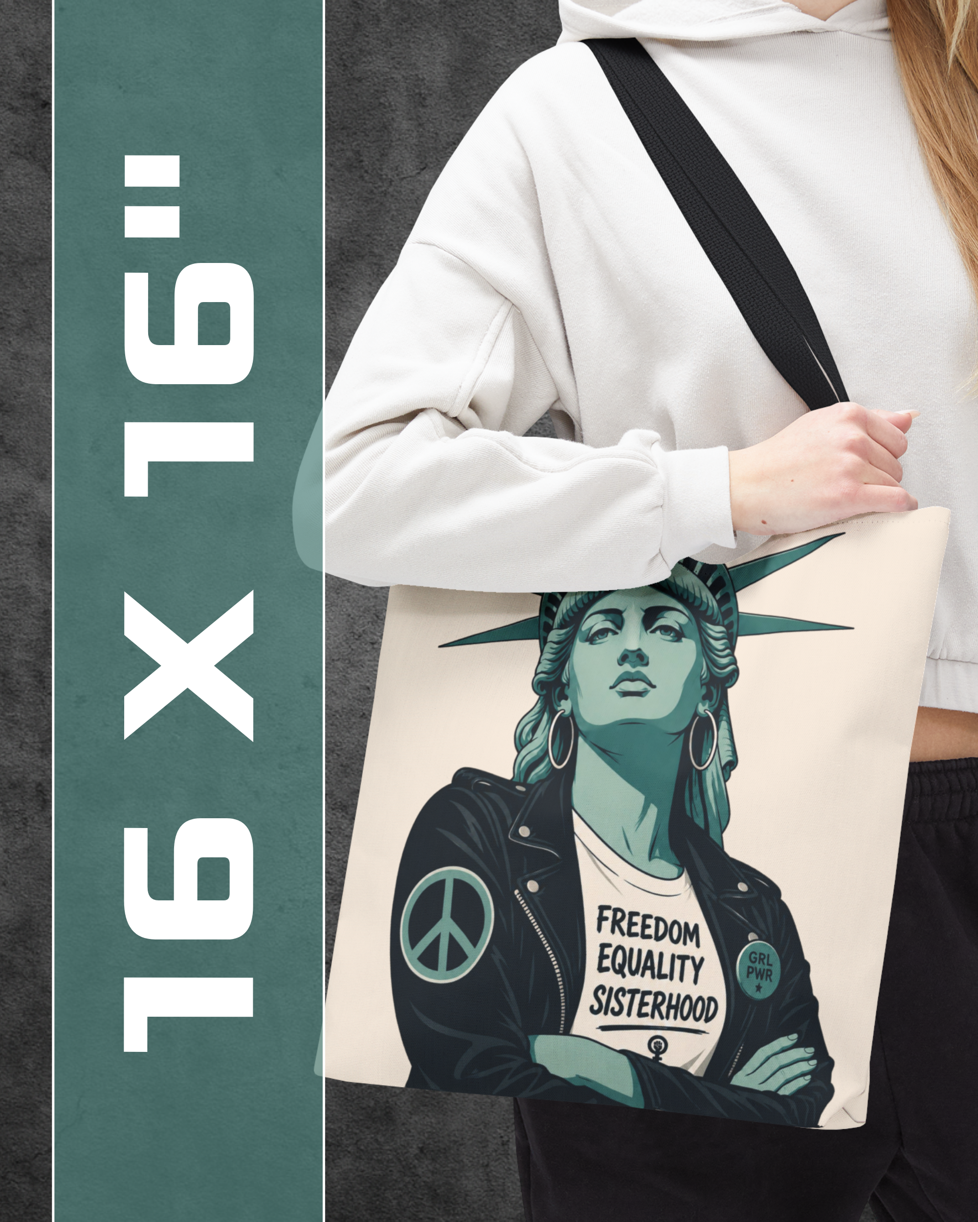 Person holding a tote bag with a stylized depiction of the Statue of Liberty wearing a jacket with 'Freedom Equality Sisterhood' text.
