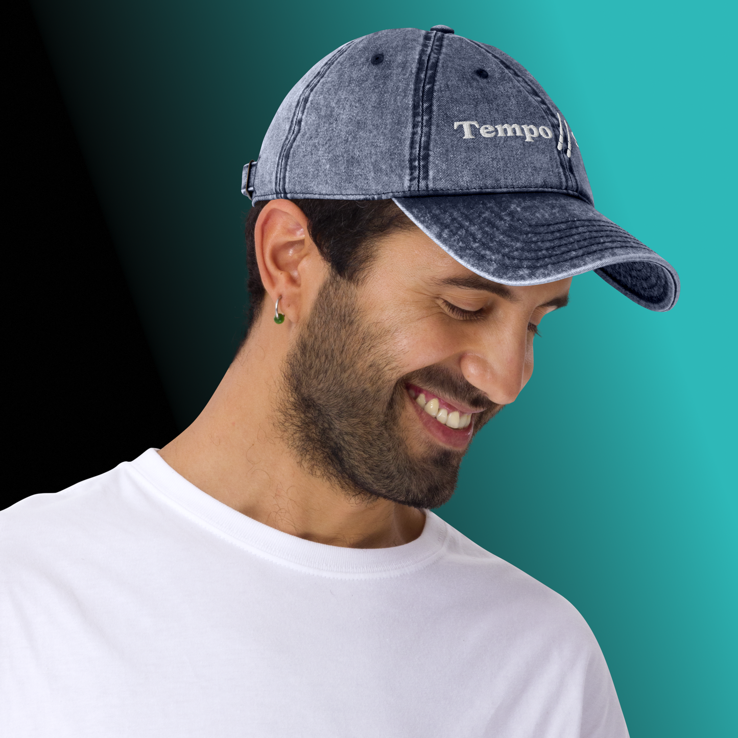 Man wearing a denim cap with 'Tempo Slave' on a gradient background