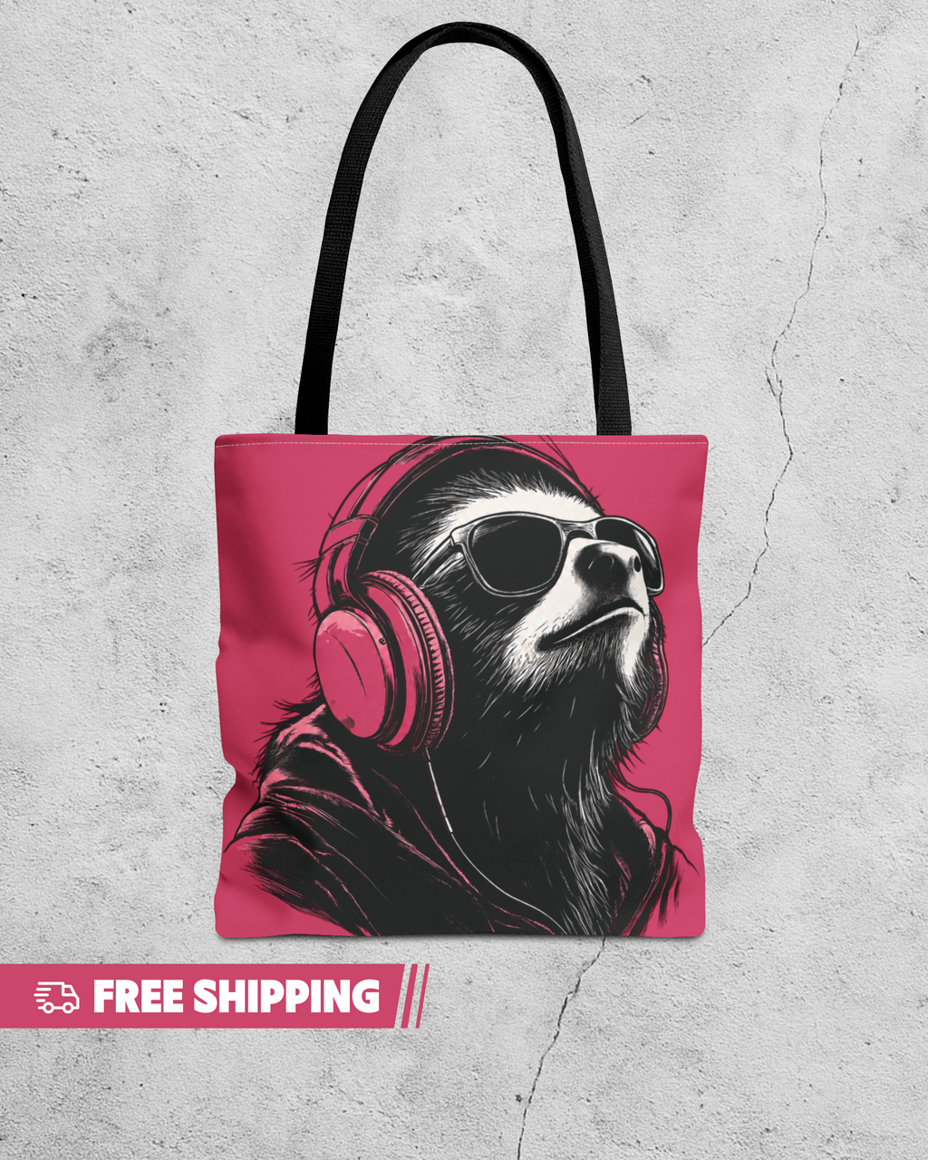 Tote bag with a sloth wearing headphones and sunglasses on a pink background, placed on a textured gray surface.