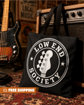 Black tote bag with 'Low End Society' logo in front of a guitar and amplifier.