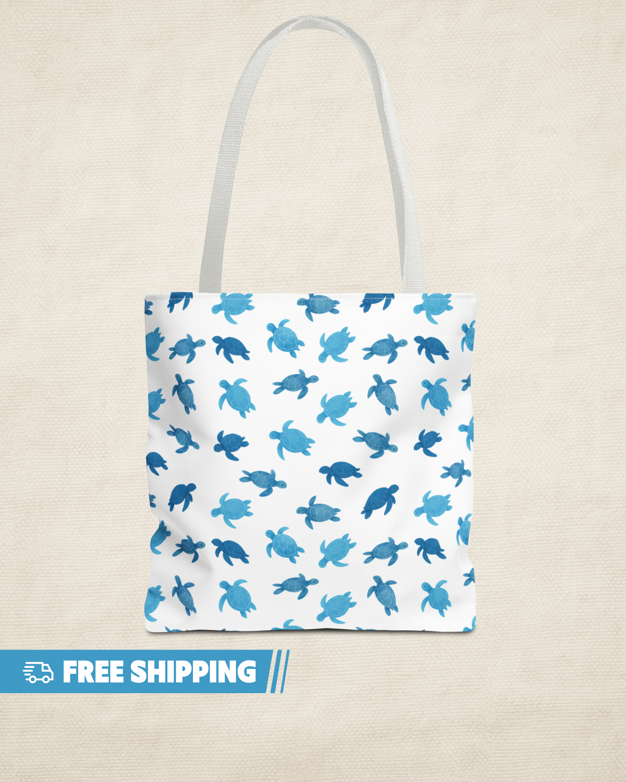 Tote bag with blue turtle pattern on a beige background