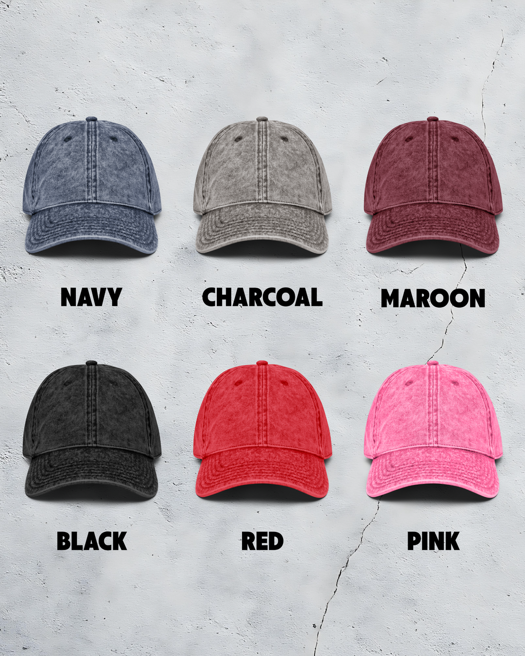 Six baseball caps in different colors on a textured gray background