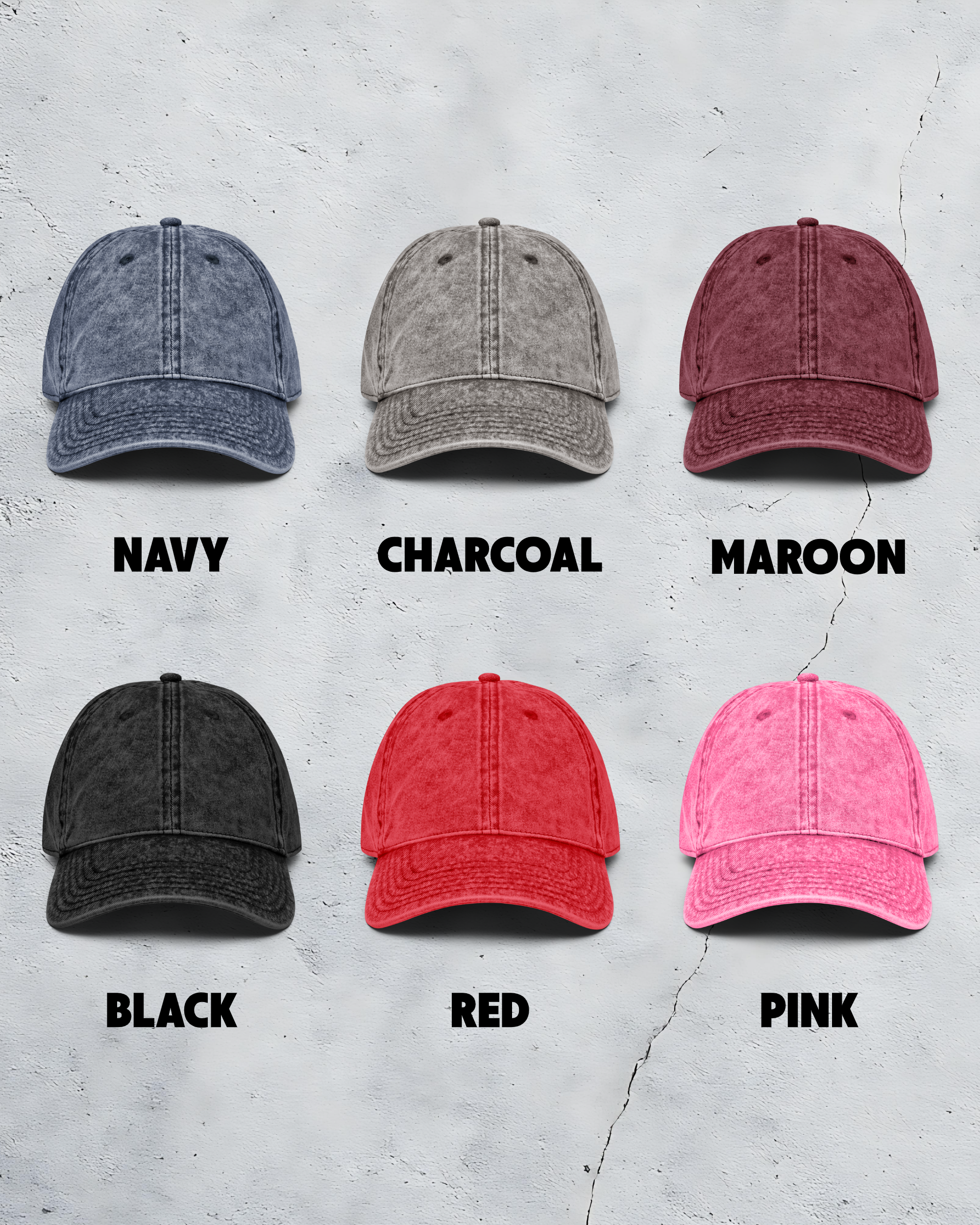 Six baseball caps in different colors on a textured gray background