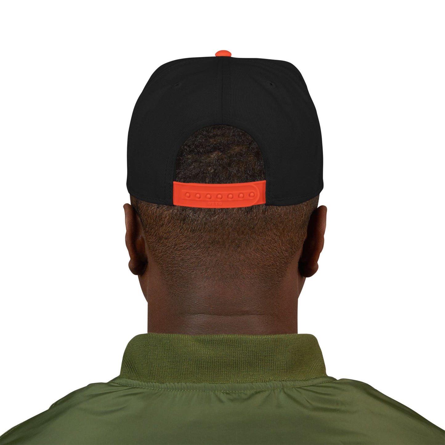Person wearing a black cap with an orange logo on the back, facing away from the camera.