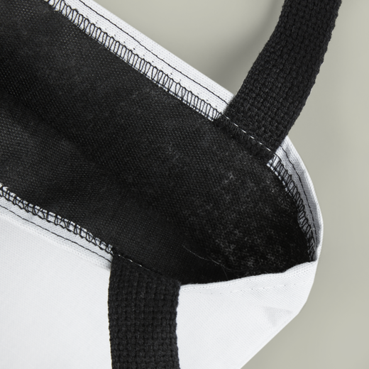 Close-up of a black and white fabric product on a neutral background