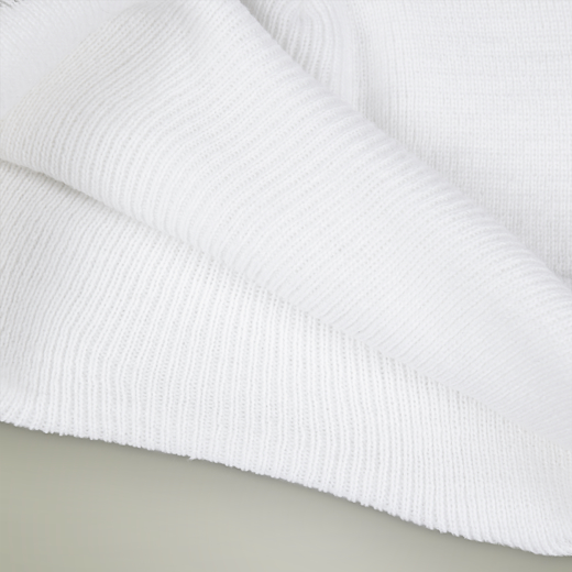 Close-up of a white textured fabric on a light gray background